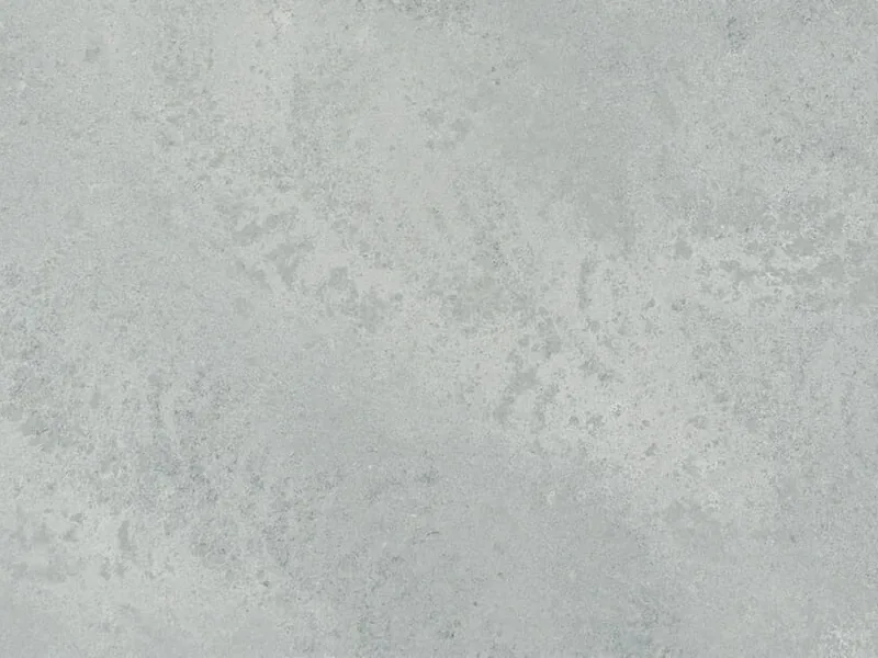 Caesarstone Airy Concrete quartz swatch: cloudy gray concrete-look surface with white flashes