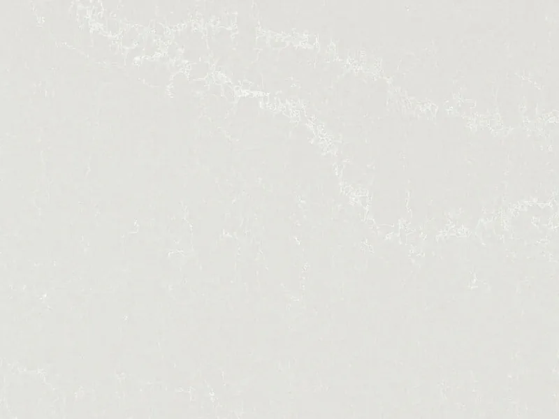 Caesarstone Alpine Mist quartz swatch: cool light gray background with crisp white veins