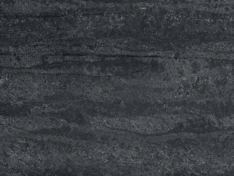 Caesarstone Black Tempal quartz swatch: charcoal background with layered warm white mineral bands