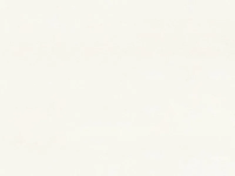 Caesarstone Blizzard quartz swatch: clean white surface with tiny gray grains