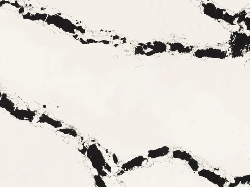 Caesarstone Calacatta Scoria quartz swatch: bright white background with oversized black veins