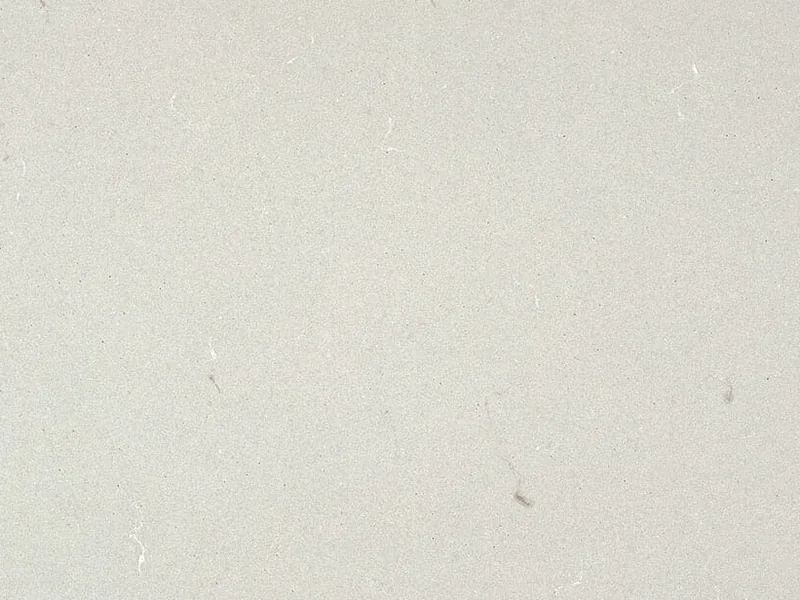 Caesarstone Fresh Concrete quartz swatch: crisp white concrete-look surface with subtle gray