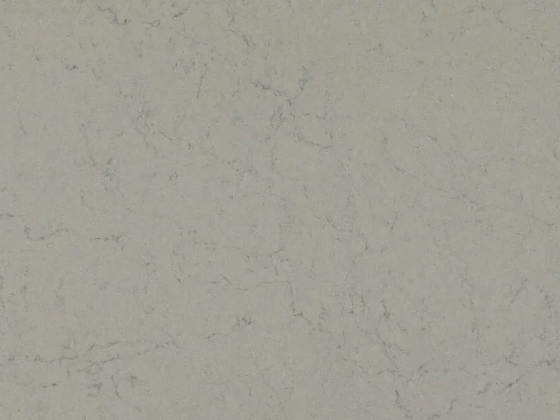 Caesarstone Georgian Bluffs quartz swatch: cloudy light gray background with soft charcoal dashes