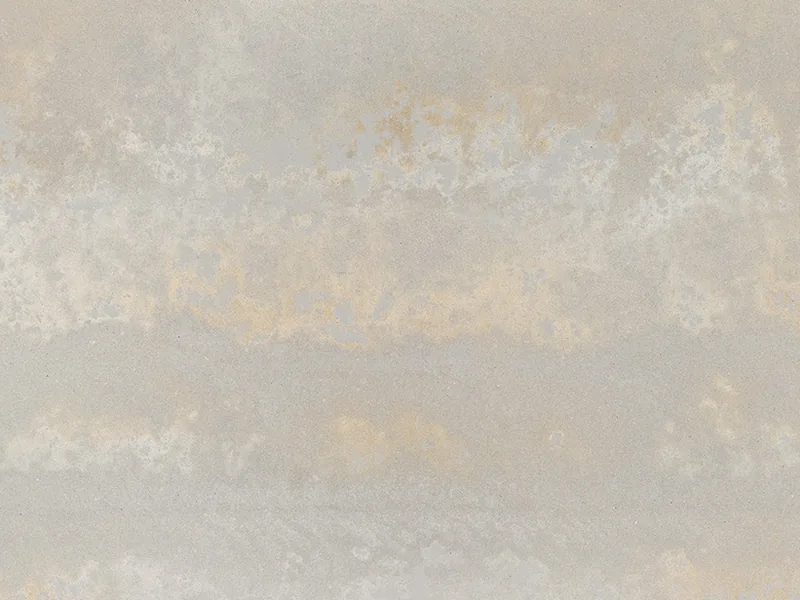 Caesarstone Primordia quartz swatch: light concrete background with off-white, gray and yellow-green traces