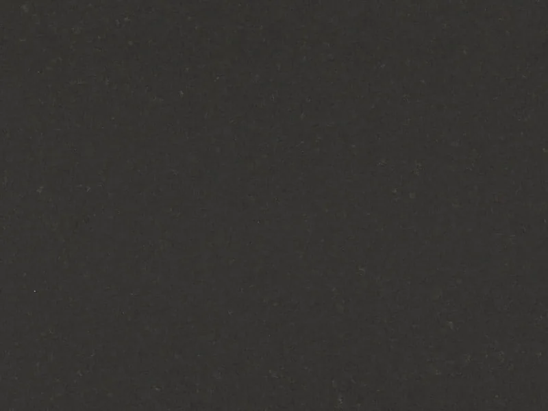 Caesarstone Raven quartz swatch: smoky slate gray and brown two-tone surface