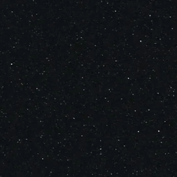 Compac Nocturno quartz swatch: deep black surface with tiny scattered reflective flecks