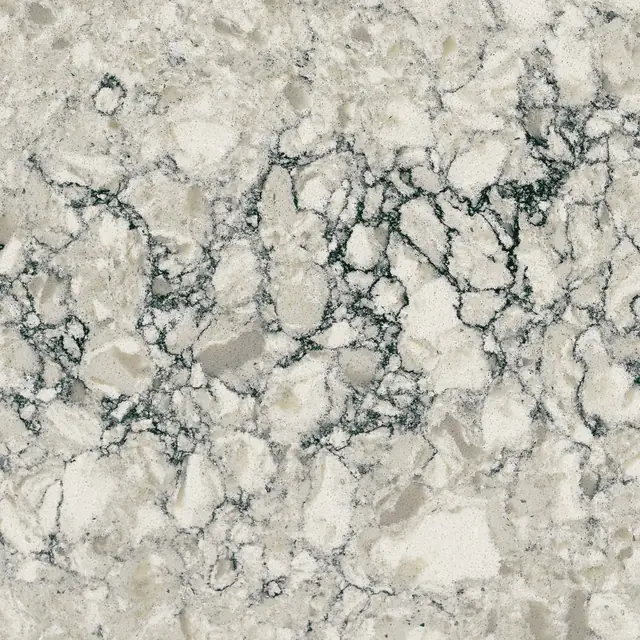 HanStone Quartz Aura swatch: warm beige and grey fragments outlined by dark veins