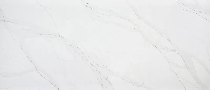MSI Q Quartz Calacatta Abezzo quartz slab: soft white background with translucent bands and earth-toned veins