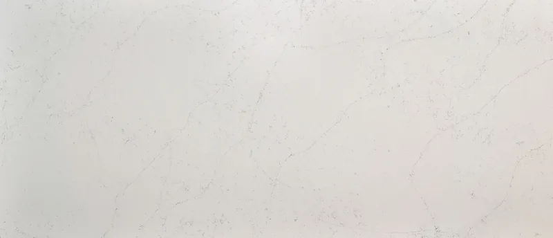 MSI Q Quartz Calacatta Botanica quartz slab: soft white background with light, loose gray veining