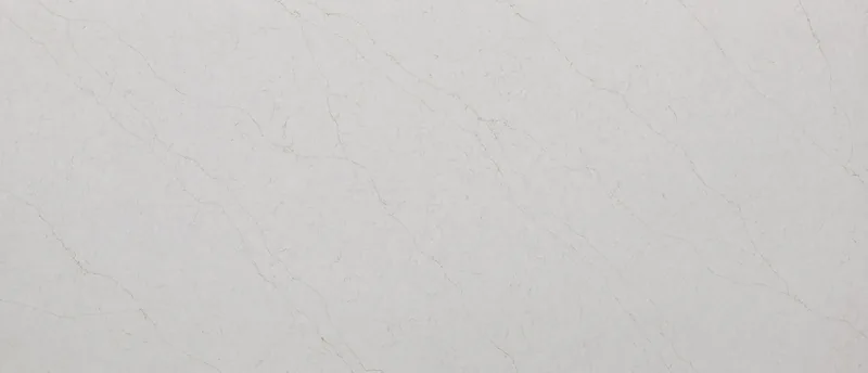 MSI Q Quartz Calacatta Karmelo quartz slab: warm white base with wispy brown veins, thin lines and specks