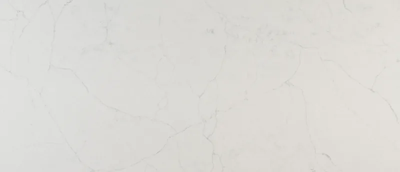 MSI Q Quartz Calacatta Monaco quartz slab: cool white background with long, thin gray veins