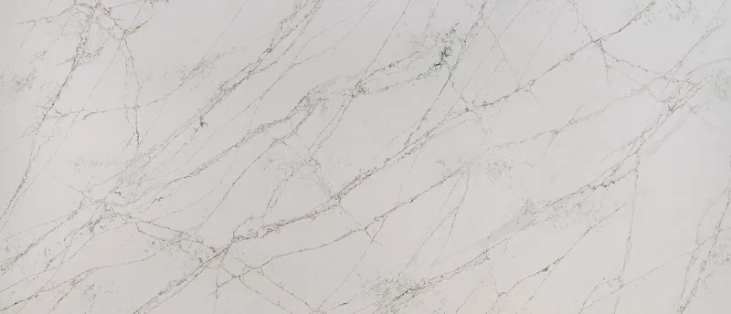 MSI Q Quartz Calacatta Viraldi quartz slab: warm white background with intertwined brown and green wispy veins