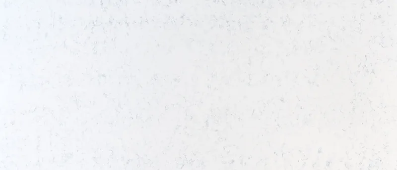MSI Q Quartz Carrara Lumos quartz slab: soft white background with wispy, feathery gray veins