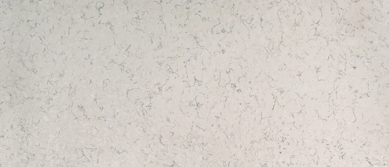 MSI Q Quartz Carrara Mist quartz slab: creamy beige background with small scattered gray veins and specks