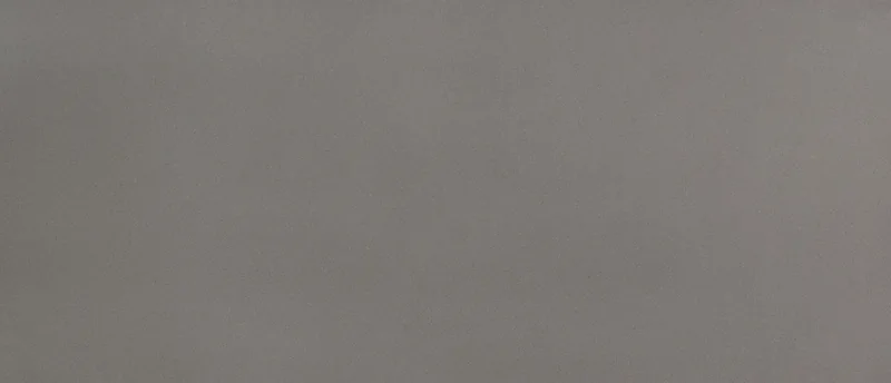 MSI Q Quartz Macabo Gray quartz slab: neutral mid-gray background with small scattered flecks
