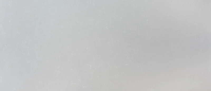 MSI Q Quartz Smoked Pearl quartz slab: light cool gray background with fine dusted white veins