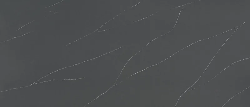 MSI Q Quartz Soapstone Metropolis quartz slab: slate-gray background with long thin white diagonal veins