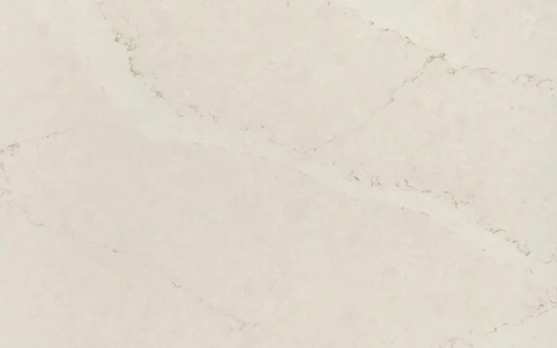 Silestone Calacatta Tova countertop swatch: soft cream background with sweeping pale veins