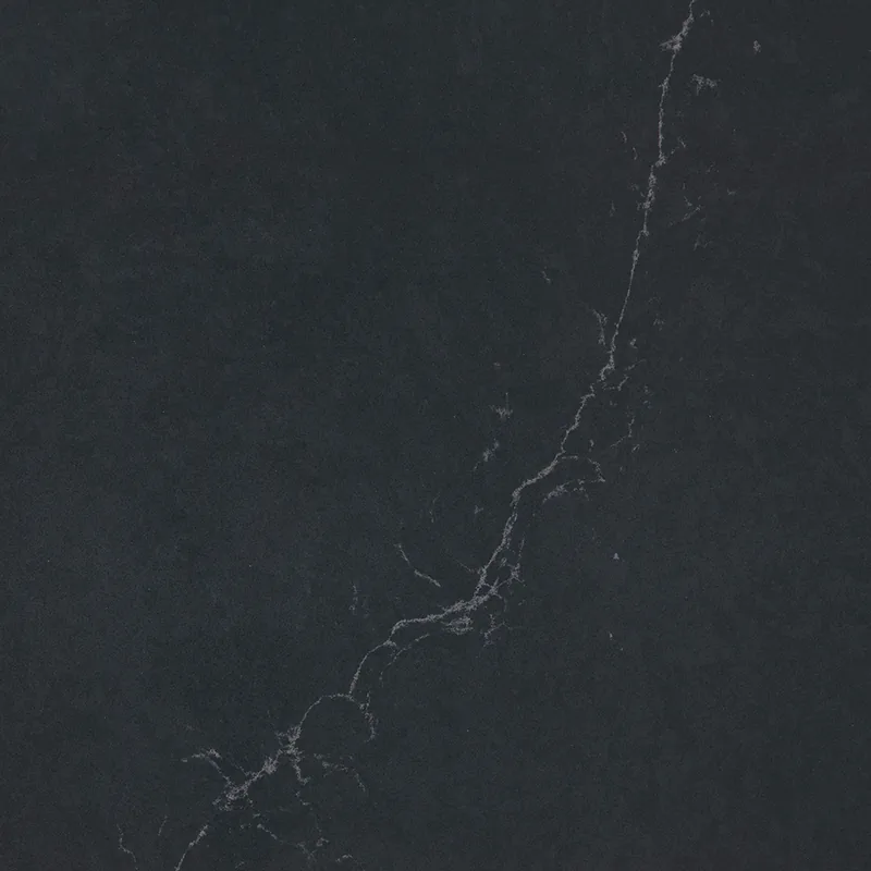 Silestone Charcoal Soapstone countertop swatch: blue-gray charcoal background with a thin gray vein