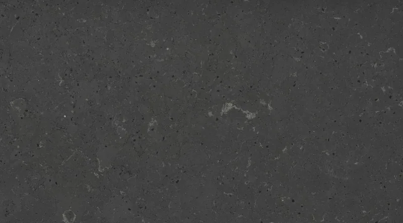 Silestone Cinder Craze countertop swatch: charcoal sandstone-look surface with grain and pale shell veins
