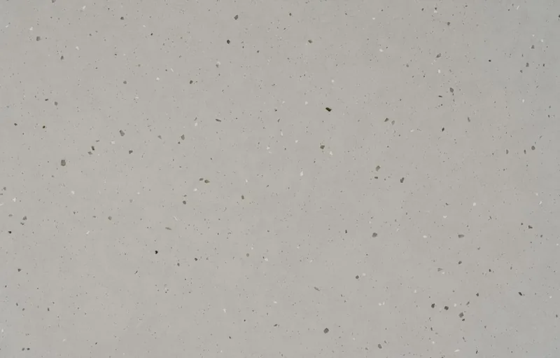 Silestone Concrete Pulse countertop swatch: light gray concrete-look surface with dark flecks