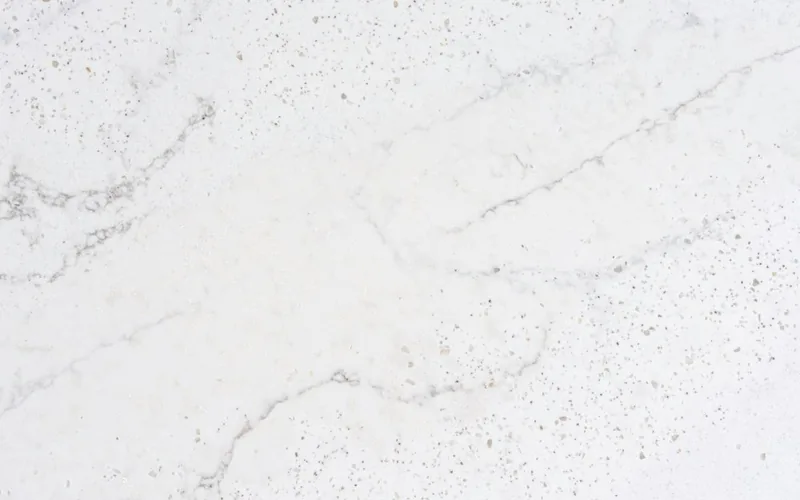 Silestone Eclectic Pearl countertop swatch: white background with gray veins and scattered dark grains