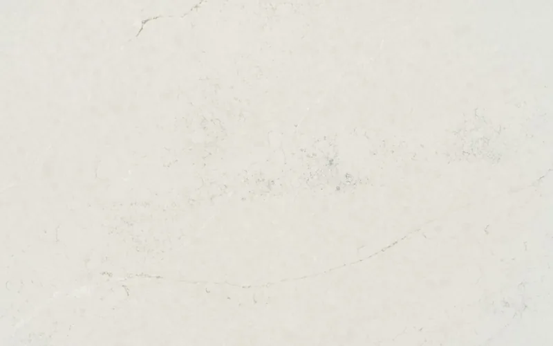 Silestone Lightborne countertop swatch: soft off-white background with faint cloudy patches and hairline veins