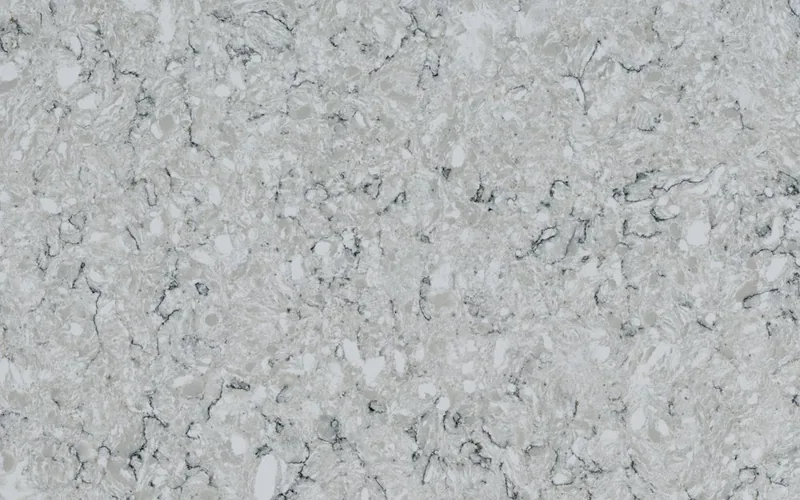 Silestone Pietra countertop swatch: light gray-green background with pebble-like mottling and dark outlines