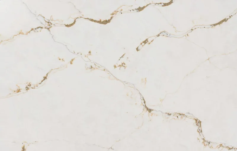 Silestone Versailles Ivory countertop swatch: white background with bold golden veins