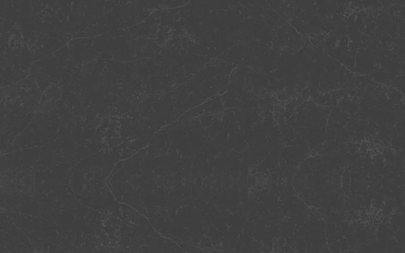 Wilsonart Charcoal Peak quartz swatch: gray marble-look surface with moderate veining