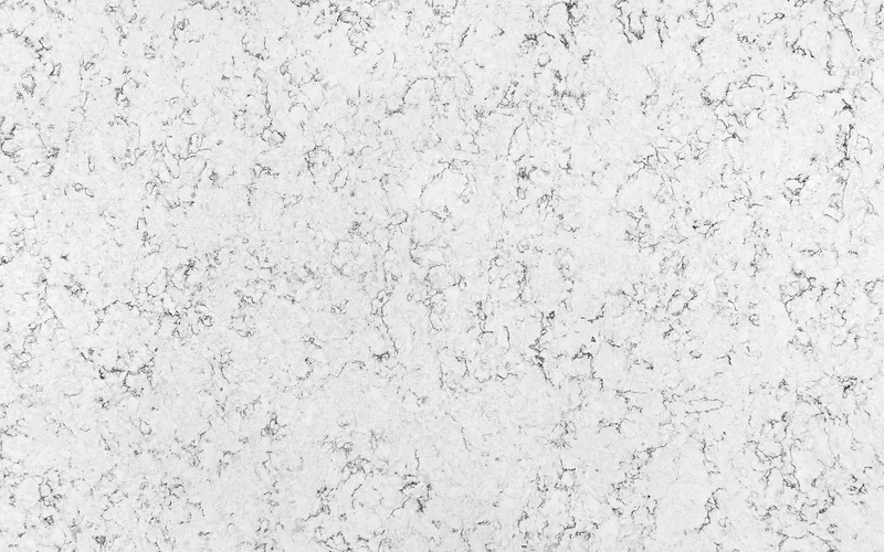 Wilsonart Kolams quartz swatch: white marble-look surface with moderate veining