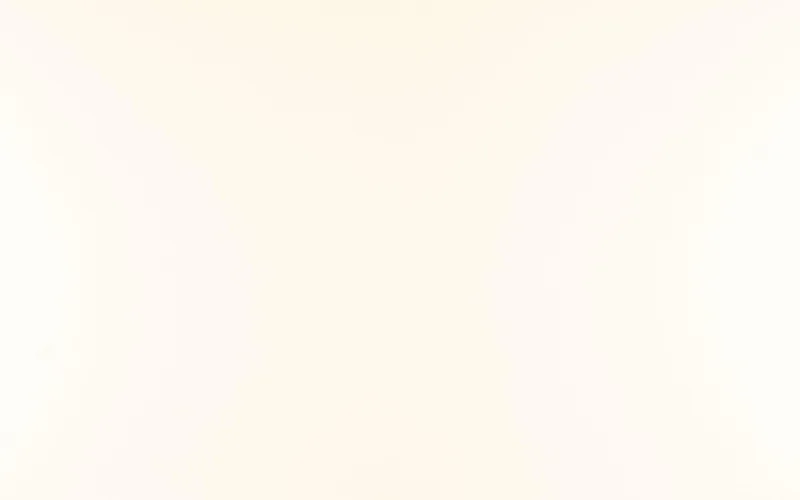 Wilsonart Lazio quartz swatch: white fine-speckled surface with no veining