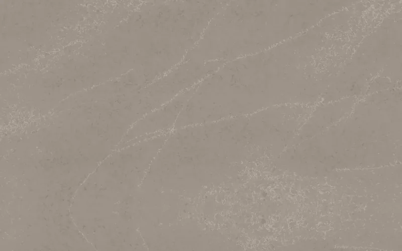 Wilsonart Permian Slate quartz swatch: brown marble-look surface with moderate veining