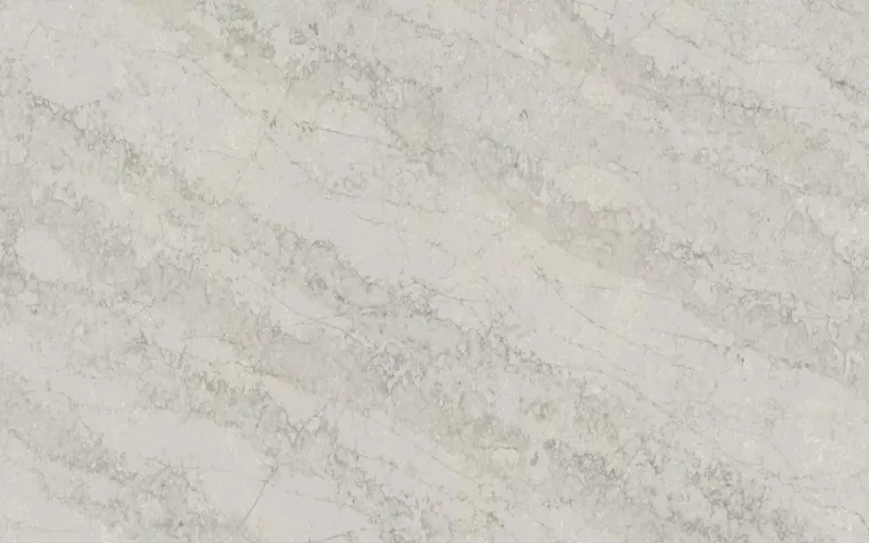 Wilsonart Sandswept Cove quartz swatch: beige marble-look surface with bold veining