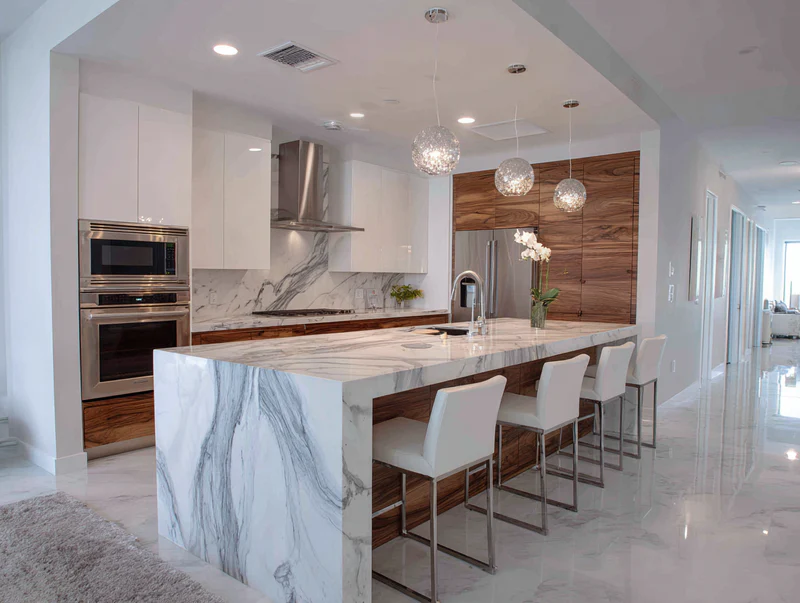 Kitchen with Calacatta quartz, walnut island and orchids