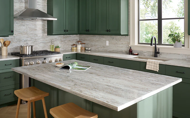 Kitchen with green cabinets and cream quartz countertops