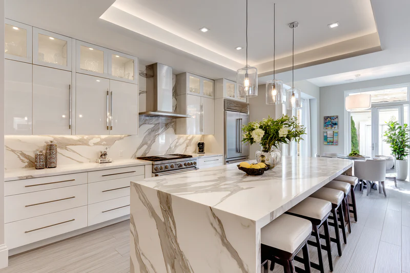Transitional kitchen with Calacatta quartz and tray ceiling