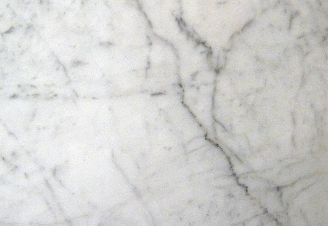 Polished white Carrara marble with gray veining